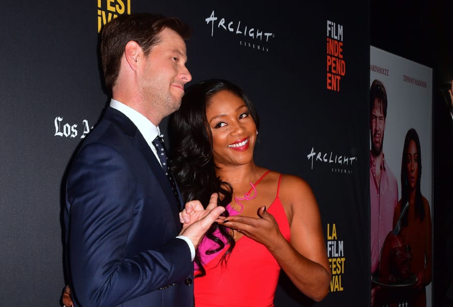 Actor Ike Barinholtz, left, and actress Tiffany Haddish arrive for the premiere of the film &quot;The Oath&quot; in Hollywood, Calif., in 2018. (Frederic J.