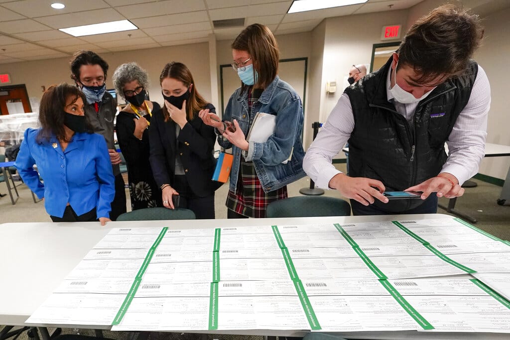 Democratic and Republican canvas observers inspect Lehigh County provisional ballots as vote counting in the general election continues, Friday, Nov. 6, 2020, in Allentown, Pa.