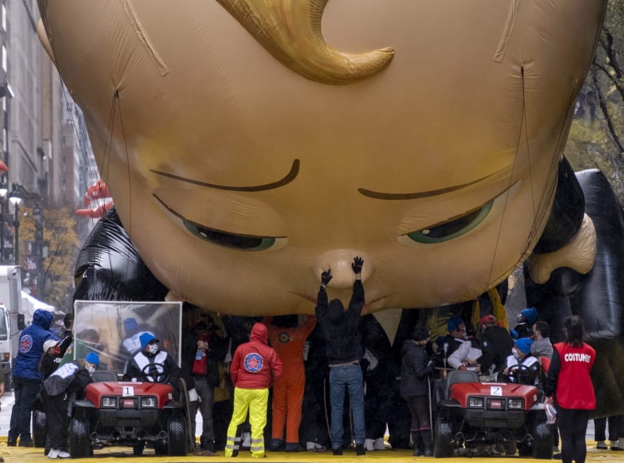 The Boss Baby balloon is deflated as it ends its appearance during the modified Macy&#039;s Thanksgiving Day Parade in New York, Thursday, Nov. 26, 2020. The annual parade goes on but only after great changes as compared to previous years due to the current deadly pandemic.