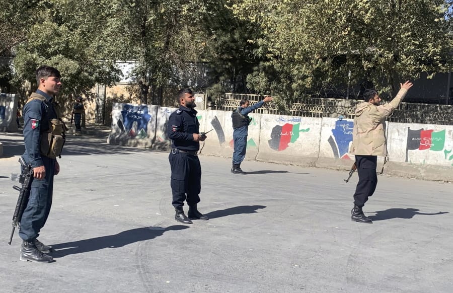 Afghan police arrive at the site of an attack at Kabul University in Kabul, Afghanistan, Monday, Nov. 2, 2020. Gunfire erupted at the university in the Afghan capital early Monday and police have surrounded the sprawling campus, authorities said.