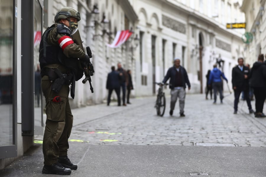 A military police officer guard at the crime scene near a synagogue in Vienna, Austria, Wednesday, Nov. 4, 2020. Several shots were fired shortly after 8 p.m. local time on Monday, Nov. 2, in a lively street in the city center of Vienna.