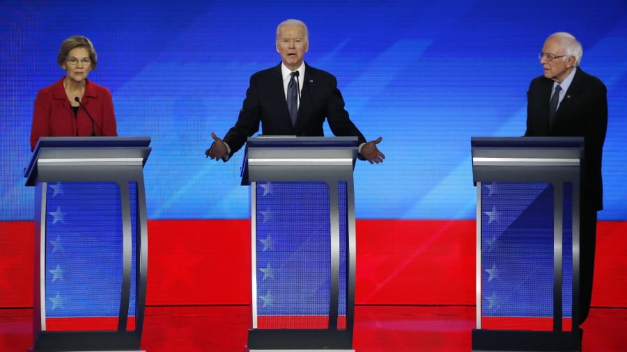FILE - In this Feb. 7, 2020, file photo Democratic presidential candidate former Vice President Joe Biden, center, speaks as Sen. Elizabeth Warren, D-Mass., left, and Sen. Bernie Sanders, I-Vt., listen during a Democratic presidential primary debate hosted by ABC News, Apple News, and WMUR-TV at Saint Anselm College in Manchester, N.H. Sanders and Warren, the faces of the Democratic Party&#039;s far-left wing, are at risk of being excluded from the senior ranks of President-elect Biden&#039;s administration as the incoming president balances the demands of his party&#039;s progressive base against the political realities of a narrowly divided Senate.