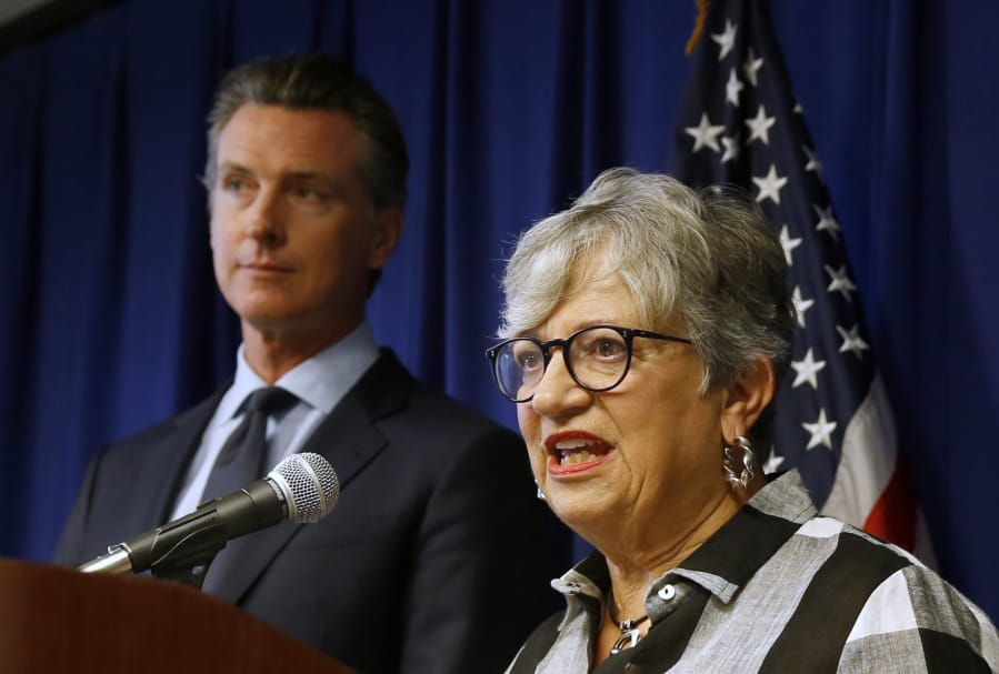 FILE - In this Sept. 18, 2019, file photo, California Air Resources Board Chair Mary Nichols, with California Gov. Gavin Newsom at left, discusses the Trump administration&#039;s pledge to revoke California&#039;s authority to set vehicle emissions standards that are different than the federal standards, during a news conference in Sacramento, Calif. Nichols&#039; term leading the state ARB ends in December 2020. She&#039;s held the role since 2007 after an earlier stint as chair in the early 1980s.