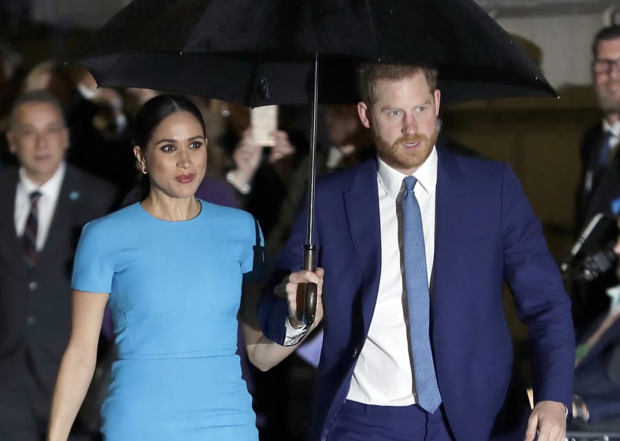 FILE - Prince Harry and Meghan, the Duke and Duchess of Sussex arrive at the annual Endeavour Fund Awards in London on March 5, 2020. The Duchess of Sussex has revealed that she had a miscarriage in July. Meghan described the experience in an opinion piece in the New York Times on Wednesday. She wrote: &quot;I knew, as I clutched my firstborn child, that I was losing my second.&quot; The former Meghan Markle and husband Prince Harry have a son, Archie, born in 2019.