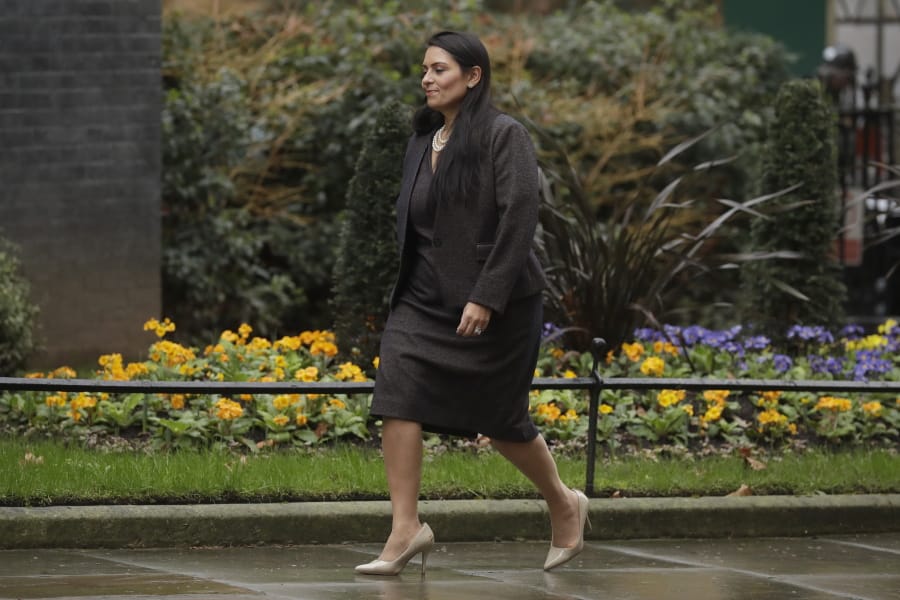 FILE - In this file photo dated Thursday, Feb. 13, 2020, British Lawmaker Priti Patel, the Home Secretary arrives at 10 Downing Street in London.  An investigation has reportedly found that Home Secretary Priti Patel broke ministerial rules by bullying staff, as a summary of its findings is expected to be released Friday Nov. 20, 2020.  Patel denies the allegations.
