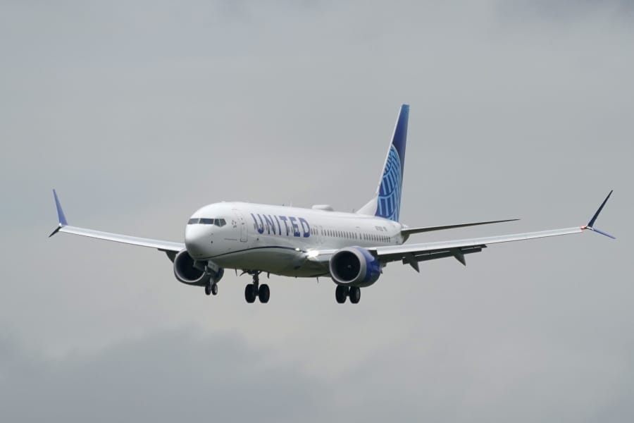 A Boeing 737 Max 9 built for United Airlines flies before landing at King County International Airport - Boeing Field after a test flight from Moses Lake, Wash., Wednesday, Nov. 18, 2020, in Seattle. After nearly two years and a pair of deadly crashes, the U.S. Federal Aviation Administration announced Wednesday that the 737 Max has been cleared for flight after regulators around the world grounded the Max in March 2019, after the crash of an Ethiopian Airlines jet. (AP Photo/Ted S.