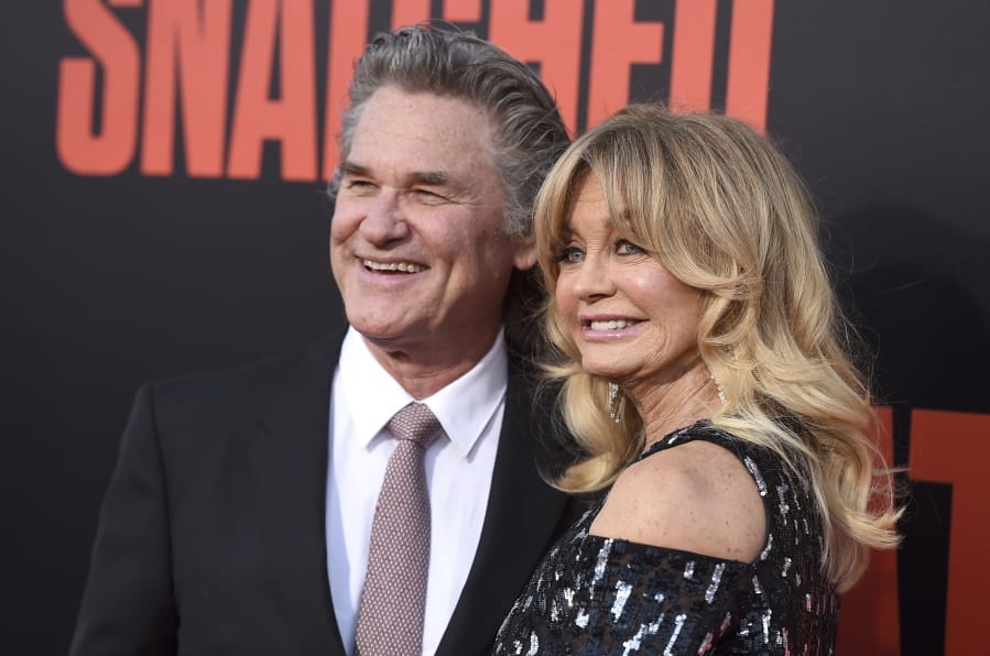 FILE - Kurt Russell, left, and Goldie Hawn appear at the premiere of Hawn&#039;s film, &quot;Snatched&quot; in Los Angeles on May 10, 2017. Russell and Hawn star in the holiday film &quot;The Christmas Chronicles: Part Two,&quot; premiering Friday on Netflix.