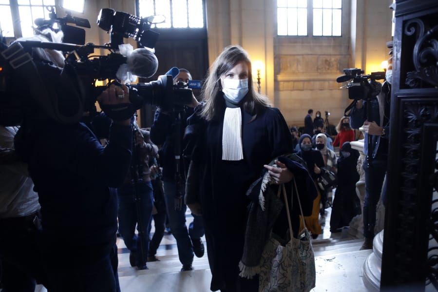 Lawyer of Islamic State operative Ayoub El Khazzaniin, Sarah Mauger-Poliak, arrives on the opening day of the Thalys attack trial, at the Paris courthouse, Monday, Nov. 16, 2020. El Khazzani goes on trial Monday Nov. 16, 2020, in France on terror charges for appearing on a train with an arsenal of weapons and shooting one passenger in 2015.