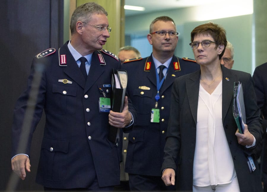 FILE - In this Thursday, Oct. 24, 2019 file photo German Defense Minister Annegret Kramp Karrenbauer, front right, arrives for a meeting of NATO defense ministers at NATO headquarters in Brussels, Belgium. Germany&#039;s defense minister on Tuesday rejected Turkish complaints over the search of a Turkish freighter in the Mediterranean Sea by a German frigate participating in a European mission, insisting that German sailors behaved correctly.