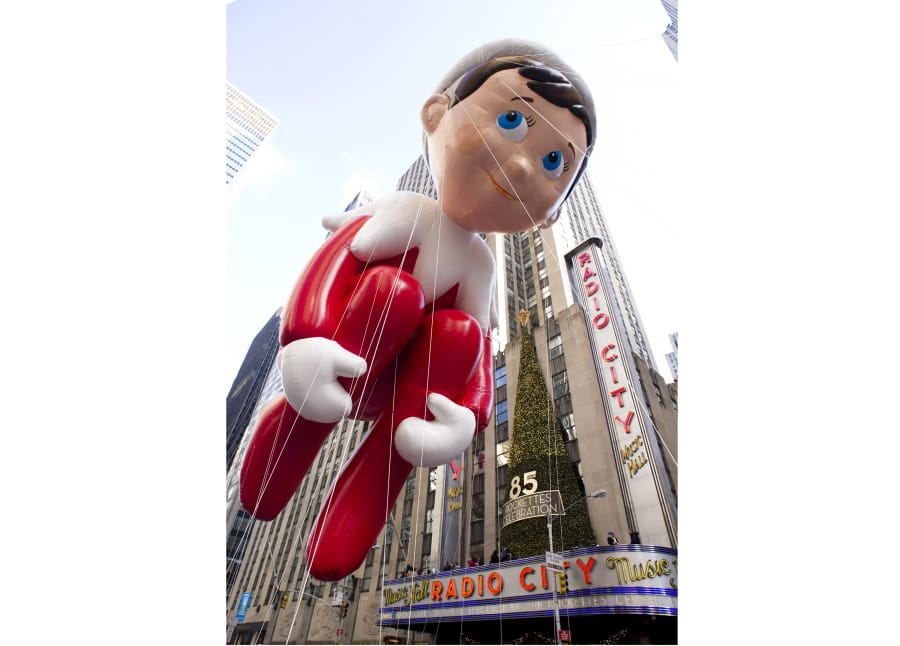 FILE - The Elf on the Shelf balloon floats in the Macy&#039;s Thanksgiving Day Parade in New York in New York on Nov. 22, 2012. The pandemic may have upended most traditions this holiday season but the annual New York City parade will still march on with balloons, dancers, floats, Broadway shows and Santa -- albeit this time heavily tweaked for safety.