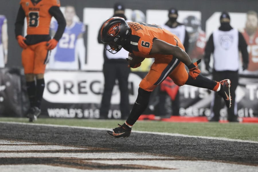 Oregon State running back Jermar Jefferson scores a touchdown during the second half of an NCAA college football game against Oregon in Corvallis, Ore., Friday, Nov. 27, 2020. Oregon State won 41-38.