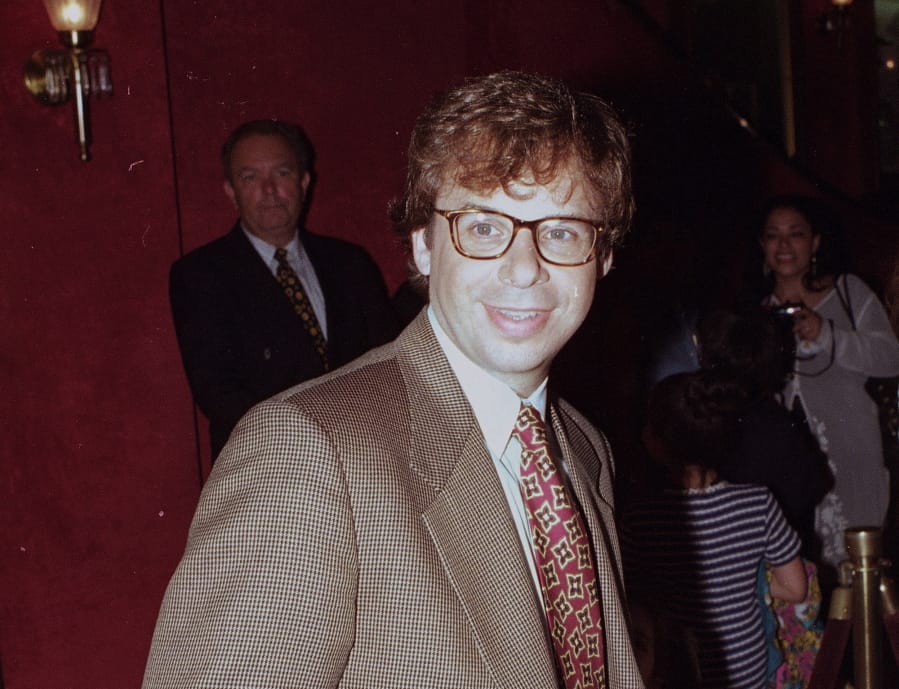FILE - In this May 1994 file photo, actor Rick Moranis is shown at an unknown location.  A law enforcement official tells the Associated Press that Moranis was sucker punched by an unknown assailant while walking Thursday, Oct. 1, 2020, on a sidewalk near New York&#039;s Central Park.   Moranis took himself to the hospital and later went to a police station to report the incident, according to the official, who was not authorized to speak publicly about the incident and did so on condition of anonymity.