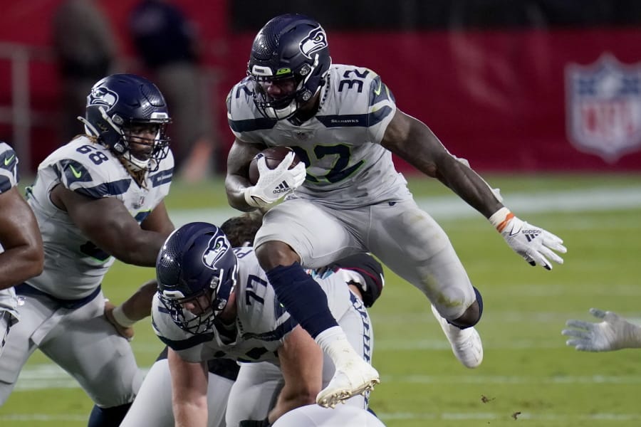 Seattle Seahawks running back Chris Carson (32) runs against the Arizona Cardinals during the first half of an NFL football game, Sunday, Oct. 25, 2020, in Glendale, Ariz. (AP Photo/Ross D.