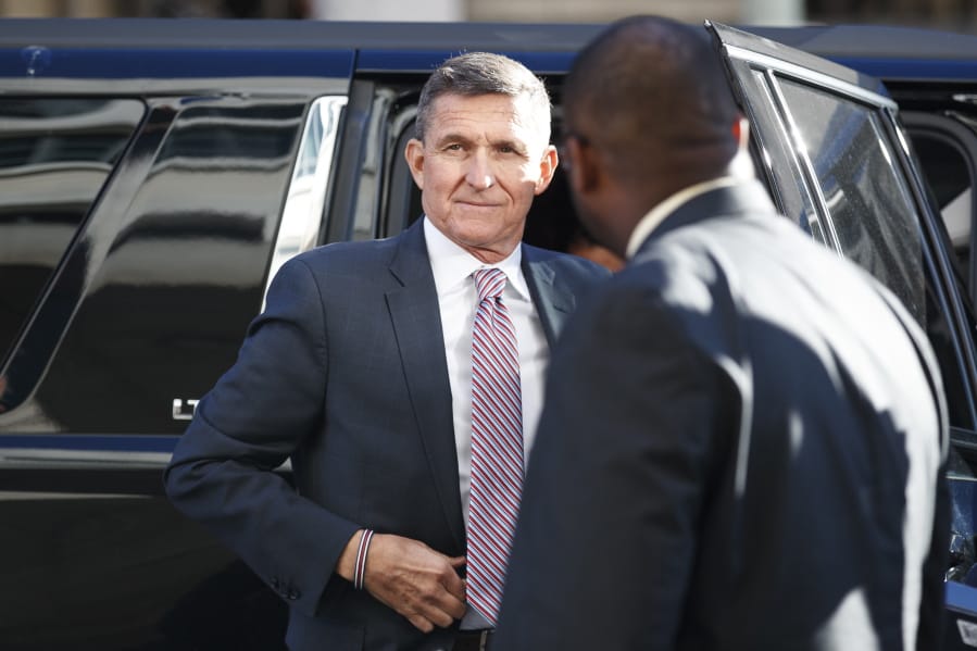 FILE - President Donald Trump&#039;s former National Security Advisor Michael Flynn arrives at federal court in Washington, Tuesday, Dec. 18, 2018. President Donald Trump has pardoned Michael Flynn, taking direct aim in the final days of his administration at a Russia investigation that he has long insisted was motivated by political bias. Trump announced the pardon on Wednesday, Nov.