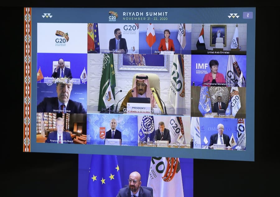 European Council President Charles Michel, on screen bottom, participates in a virtual G20 meeting, hosted by Saudi Arabia, at the European Council building in Brussels, Saturday, Nov. 21, 2020.