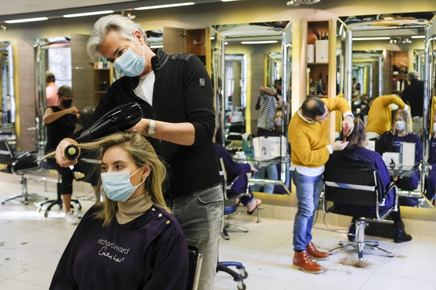Books? Hairdressers? Europeans split on lockdown essentials - The Columbian