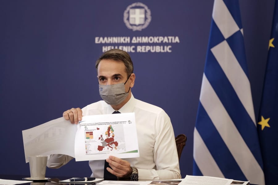 In this photo provided by the Greek Prime Minister&#039;s Office, Greece&#039;s Prime Minister Kyriakos Mitsotakis shows a map of Europe during his announcement on the country&#039;s new lockdown in Athens, Thursday, Nov. 5, 2020. Mitsotakis has announced a nationwide three-week lockdown starting Saturday morning, saying that the increase in the coronavirus infections must be stopped before Greece&#039;s health care system comes under &quot;unbearable&quot; pressure.