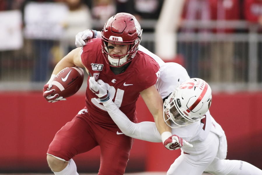 Washington State running back Max Borghi, left, is likely to get more rushing attempts under the new head coach Nick Rolovich.