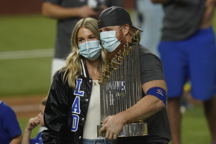 Los Angeles Dodgers third baseman Justin Turner celebrates with the trophy after defeating the Tampa Bay Rays 3-1 to win the baseball World Series in Game 6 Tuesday, Oct. 27, 2020, in Arlington, Texas.
