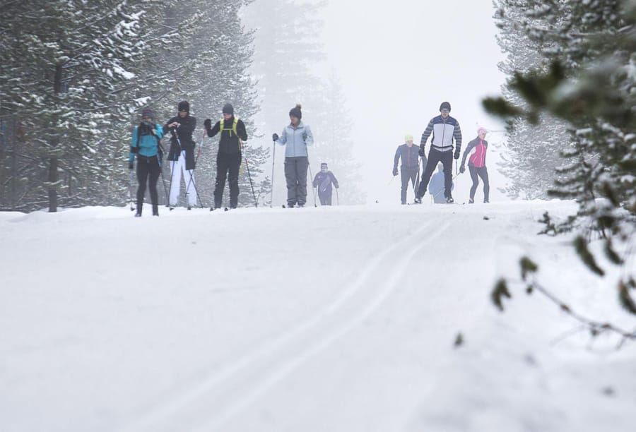 Skiers make their way out onto the trails at Meissner Sno-park west of Bend, Ore.
