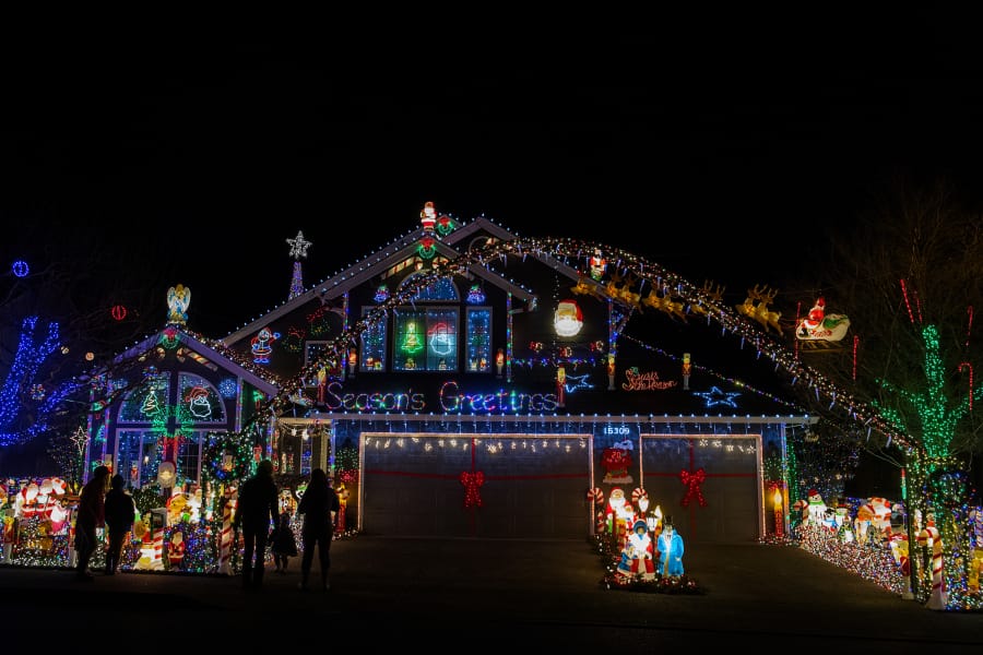 At the Buchanan home at 15309 N.E. 7th St., Vancouver, thousands of colorful lights illuminate the night sky.