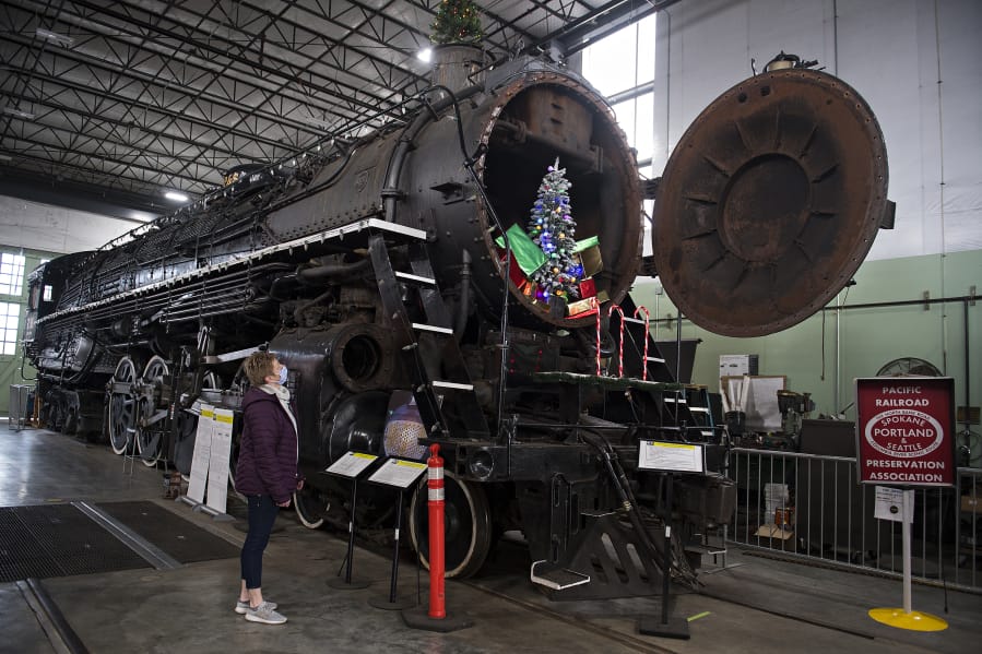 Renee Devereux of the Oregon Rail Heritage Center takes in the view of the SP&amp;S 700, a steam locomotive that ran thousands of passenger trains through the Columbia River Gorge. It&#039;s been out of service since 2015 due to a federally required boiler inspection and maintenance. It may run again in 2021. At top, the SP&amp;S 700 is equipped with eight drive wheels, each 77 inches in diameter.
