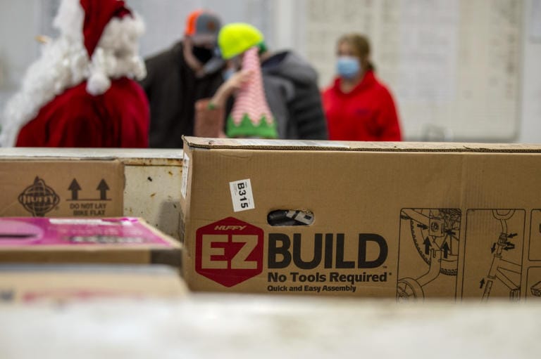 Volunteers were given several boxes of bicycle parts that they will later build on Saturday, December 12, 2020, at Taylor Transport in Vancouver. Volunteers picked up the parts to bicycles as part of the Scott Campbell Christmas Promise.