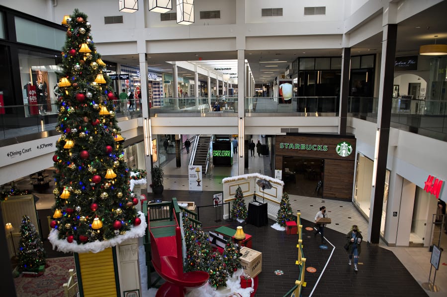 A colorful Christmas tree adds a festive touch for shoppers and workers at Vancouver Mall. Despite COVID-19 occupancy restrictions, general manager Tracy Peters said, the mall has done relatively well during the current holiday shopping season.