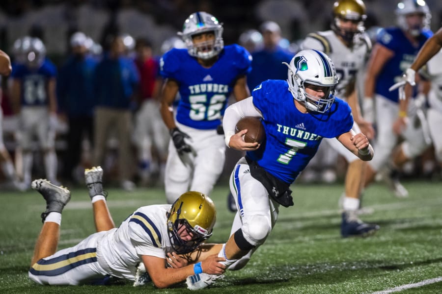 A Kelso defender brings down Mountain View quarterback Riley McCarthy during a game at McKenzie Stadium on Friday night, Oct. 25, 2019.