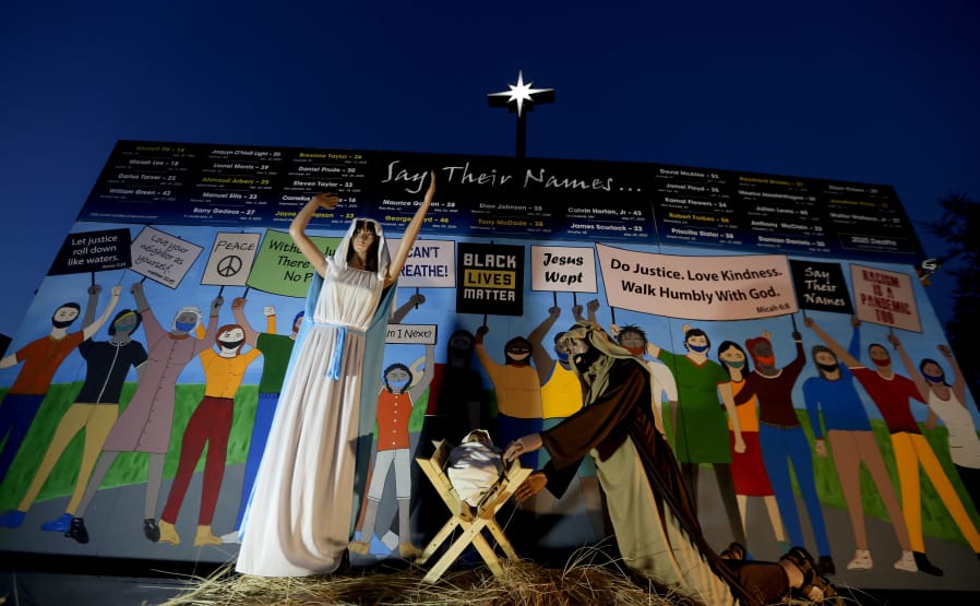 Claremont United Methodist Church put up a Nativity scene that shows Mary, Joseph and baby Jesus in front of a wall of people wearing masks and carrying signs that read CfuBlack Lives Matter,Cfu CfuI canCfUt breatheCfu and CfuJesus wept,Cfu along with Bible verses.