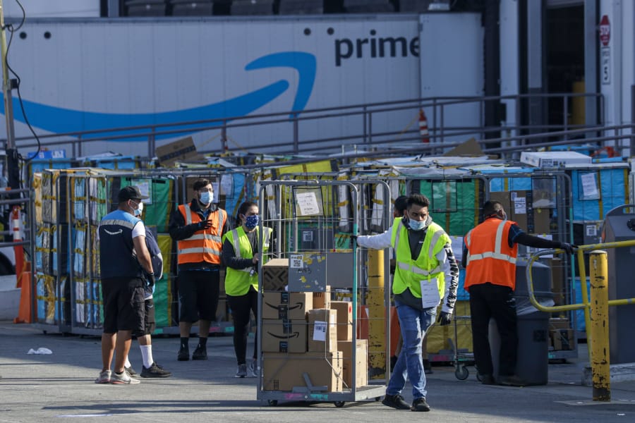 Employees at an Amazon warehouse in Hawthorne, Calif. Many Amazon warehouse employees struggle to pay the bills.