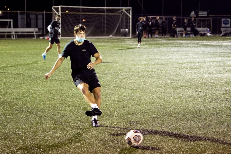 Ridgefield senior Steven Cunningham makes a pass during a Washington Timbers practice on Tuesday, December 22, 2020, at Harmony Sports Complex. Cunningham recently signed with the University of Providence to play soccer.