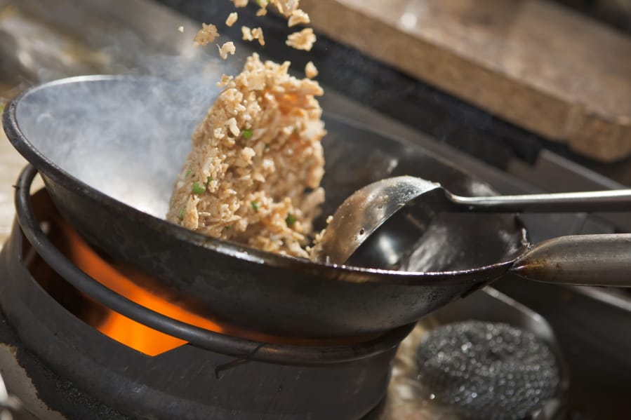 Cook Crabmeat Fried Rice in a flat-bottomed wok pan.