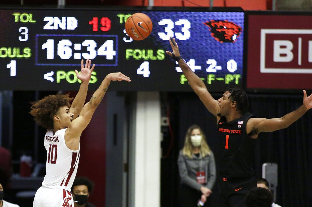 Washington State guard Isaac Bonton (10) shoots over Oregon State forward Maurice Calloo (1) during the second half of an NCAA college basketball game in Pullman, Wash., Wednesday, Dec. 2, 2020. Washington State won 59-55.
