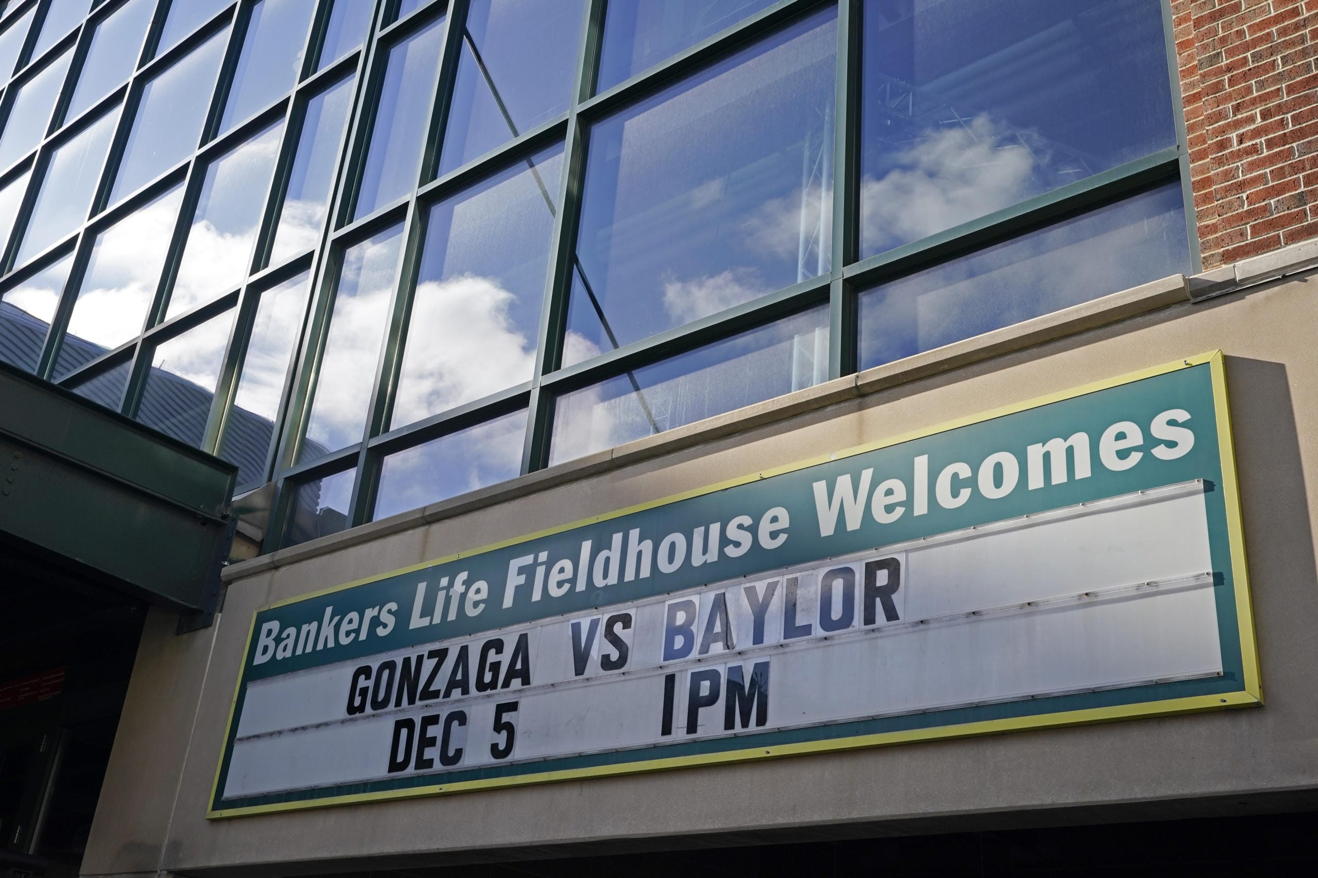 A sign outside of Bankers Life Fieldhouse shows the display for the Gonzaga vs. Baylor basketball game that was scheduled to play in an NCAA college basketball game, Saturday, Dec. 5, 2020, in Indianapolis. The game was canceled due to COVID.