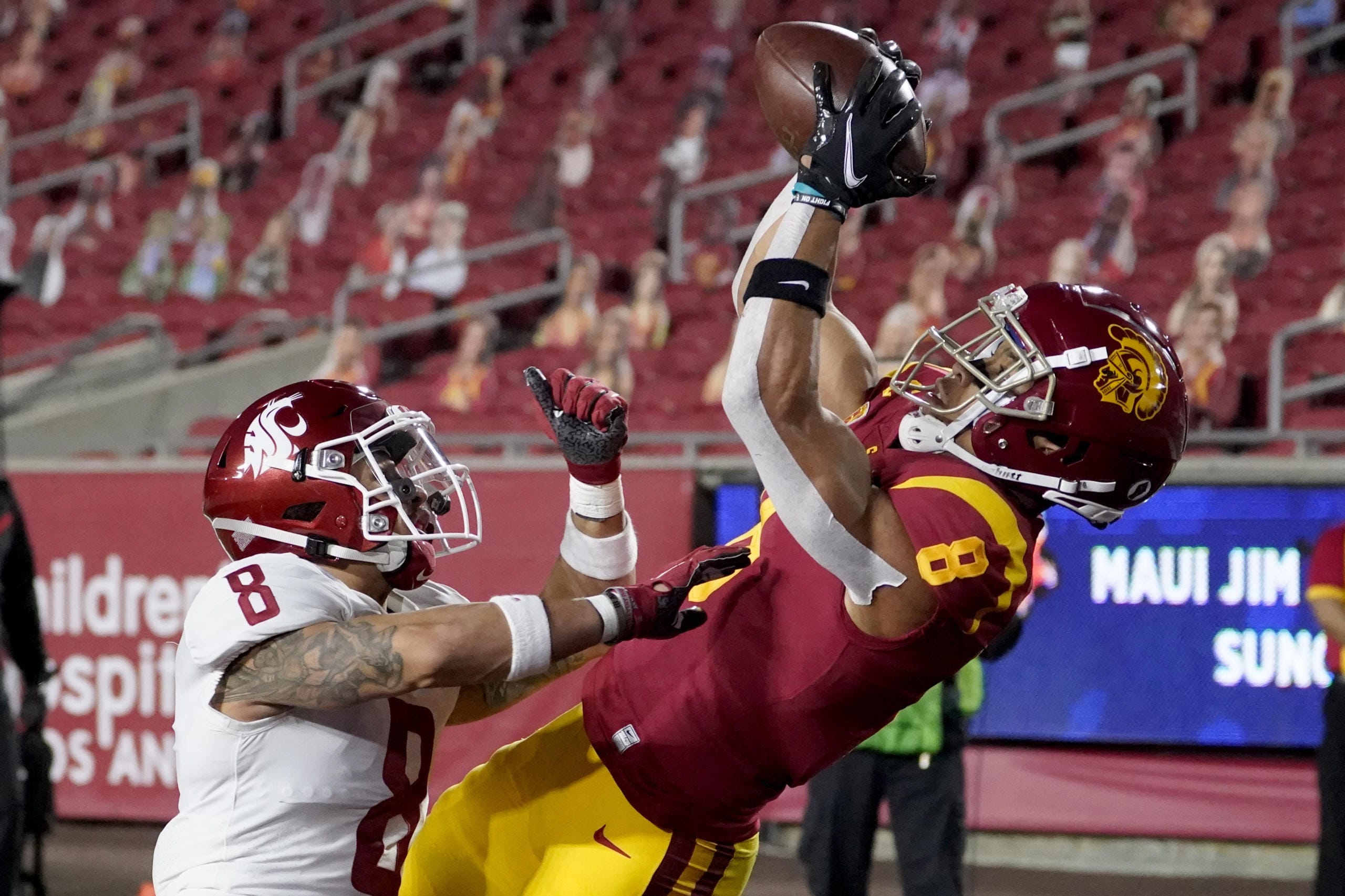 Southern California wide receiver Amon-Ra St. Brown, right, catches a touchdown over Washington State defensive back Armani Marsh during the first half of an NCAA college football game in Los Angeles, Sunday, Dec. 6, 2020.