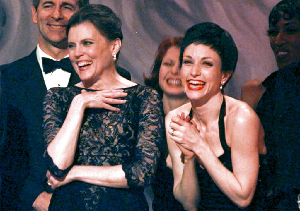 FILE - Ann Reinking, left, and Bebe Neuwirth share a laugh on stage while accepting the award for best revival of a musical during the 51st Annual Tony Awards on June 1, 1997, in New York. Reinking, a choreographer, actress and Bob Fosse collaborator who helped spread a cool, muscular hybrid of jazz and burlesque movement to Broadway and beyond, has died. She was 71.