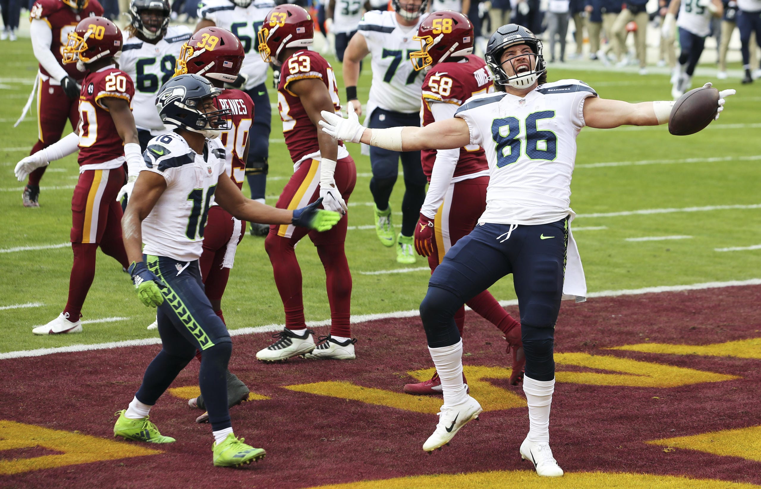 Seattle Seahawks tight end Jacob Hollister (86) celebrates after scoring a touchdown during an NFL football game against the Washington Football Team, Sunday, Dec. 20, 2020 in Landover, Md.