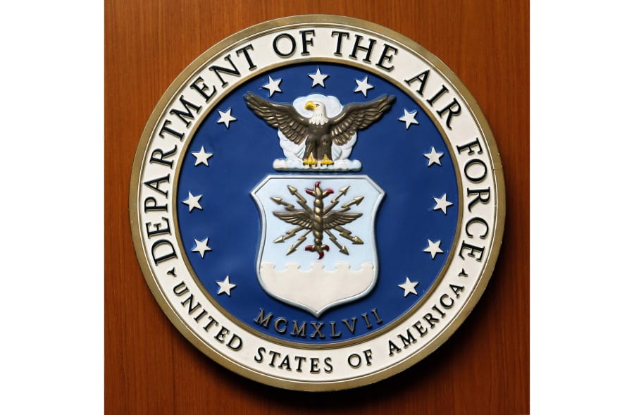 FILE - This Friday, Aug. 10, 2007, file photo, shows the logo of the Department of the U.S. Air Force at the United Staes embassy, in Berlin. A new report issued Monday, Dec. 21, 2020, on racial disparities in the Air Force concludes that Black service members in the service are far more likely to be investigated, arrested, face disciplinary actions, and be discharged for misconduct.