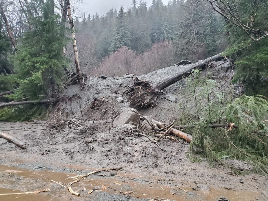 This photo provided by the Alaska Department of Transportation and Public Facilities shows damage from heavy rains and a mudslide 600 feet wide in Haines, Alaska, on Wednesday, Dec. 2, 2020. Authorities say six people are unaccounted for, and four homes were destroyed in the slide, with the search resuming Thursday morning for survivors.