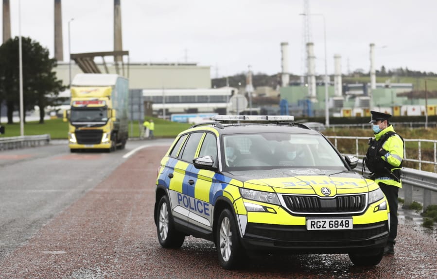 Police patrol the port of Larne, on the north coast of Northern Ireland, Thursday, Dec. 31, 2020, as the P&amp;O ferry to Scotland prepares to leave. At 11 p.m. London time -- midnight in Brussels -- Britain will economically and practically leave the the 27-nation bloc, 11 months after its formal political departure.