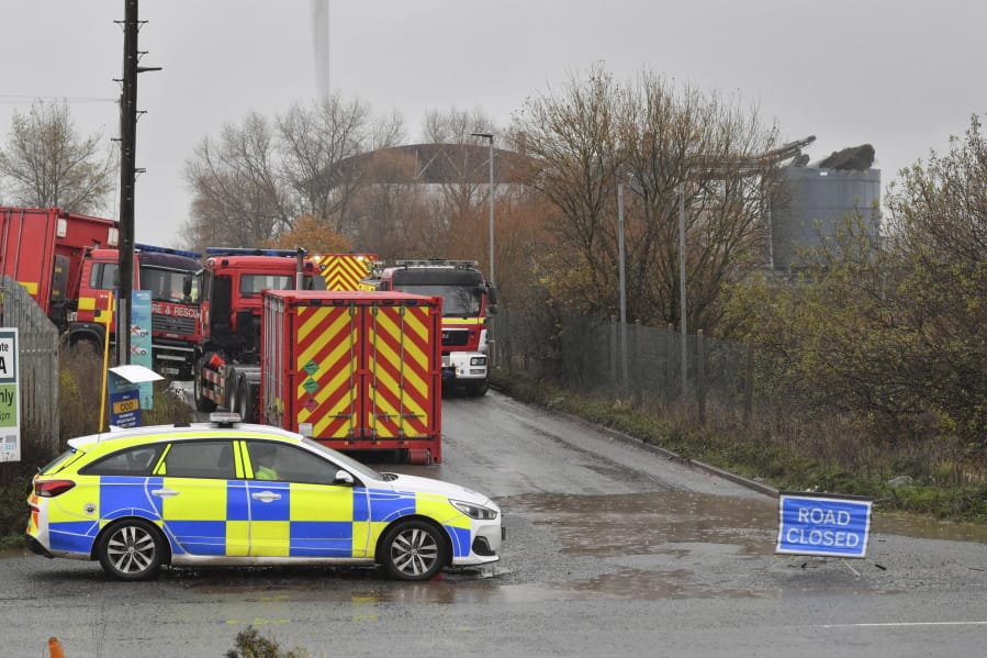Emergency services attend to a large explosion at a warehouse in Bristol, England, Thursday Dec. 3, 2020. A local British emergency services department says there have been &quot;multiple casualties&quot; following a large explosion at a warehouse near the southwest England city of Bristol.