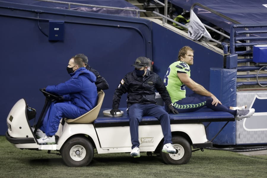 Seattle Seahawks tight end Greg Olsen (88) is taken off the field on a cart after going down with an injury against the Arizona Cardinals during the second half of an NFL football game, Thursday, Nov. 19, 2020, in Seattle.
