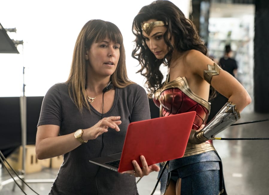 This image released by Warner Bros. Entertainment shows director Patty Jenkins, left, with actress Gal Gadot on the set of &quot;Wonder Woman 1984.&quot; (Clay Enos/Warner Bros.