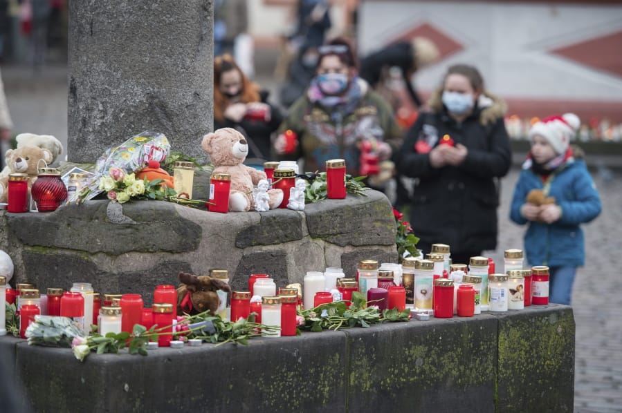 At several places in the pedestrian zone people have put up candles in memory of the victims in Trier Germany, Wednesday, Dec.2, 2020. The day before, a 51-year-old man had raced through the pedestrian zone in an SUV, killing five people in the process.