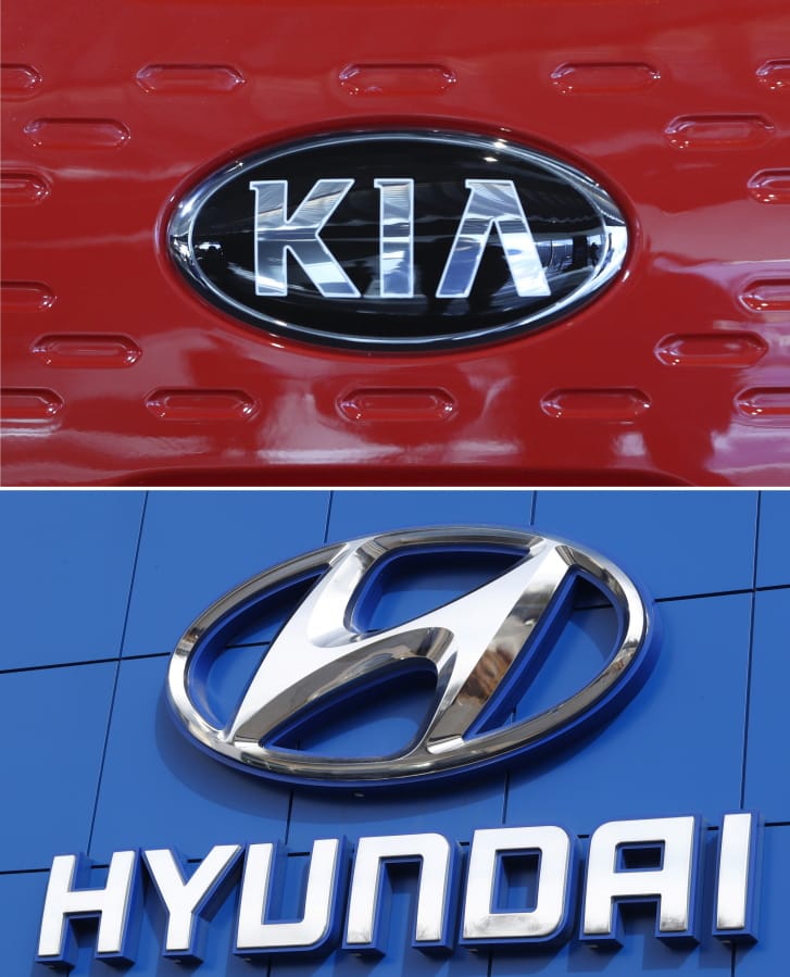 FILE- This combination of file photos shows the logo of Kia Motors during an unveiling ceremony on Dec. 13, 2017, in Seoul, South Korea, top, and Hyundai logo on the side of a showroom on April 15, 2018, in the south Denver suburb of Littleton, Colo., bottom.  Hyundai and Kia will spend $137 million on fines and safety improvements because they moved too slowly to recall over 1 million U.S. vehicles with engines that can fail. The National Highway Traffic Safety Administration announced the penalties Friday, Nov. 27, 2020.