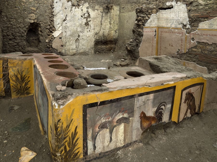 An undated photo made available by the Pompeii Archeological park press office shows the thermopolium in the Pompeii archeological park, near Naples, Italy. A fast-food eatery discovered at Pompeii is now completely excavated, helping to reveal some favorite dishes of citizens of the ancient Roman city who liked to eat out.  Pompeii Archaeological Park&#039;s longtime chief, Massimo Osanna said Saturday, Dec. 26, 2020, in a statement that while some 80 such fast-foods have been found at Pompeii, it is the first time such an eatery -- known as a thermopolium since it serve hot foods -- had been entirely excavated.