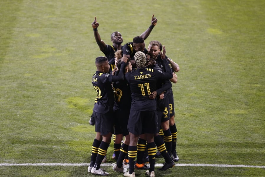 Columbus Crew players celebrate a goal against the Seattle Sounders during the first half of the MLS Championship soccer match Saturday, Dec. 12, 2020, in Columbus, Ohio.