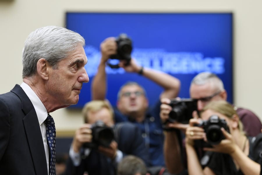 FILE - In this Wednesday, July 24, 2019, file photo, former special counsel Robert Mueller returns to the witness table following a break in his testimony before the House Intelligence Committee on Capitol Hill in Washington. NBC announced Wednesday, Dec. 2, 2020, that Mueller, the former special counsel who looked into Russian interference in the 2016 election, has given an extensive interview that debuts in early December.