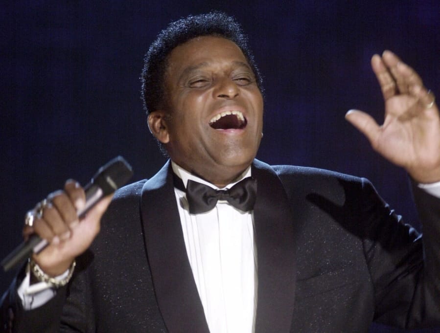 Charley Pride performs during his induction into the Country Music Hall of Fame at the Country Music Association Awards show at the Grand Ole Opry House in Nashville, Tenn., on Oct. 4, 2000.